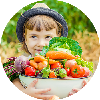 Your Health - Kid with a bowl of fresh aquaponic veggies